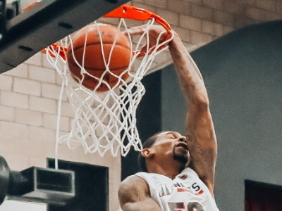 Player dunking basketball